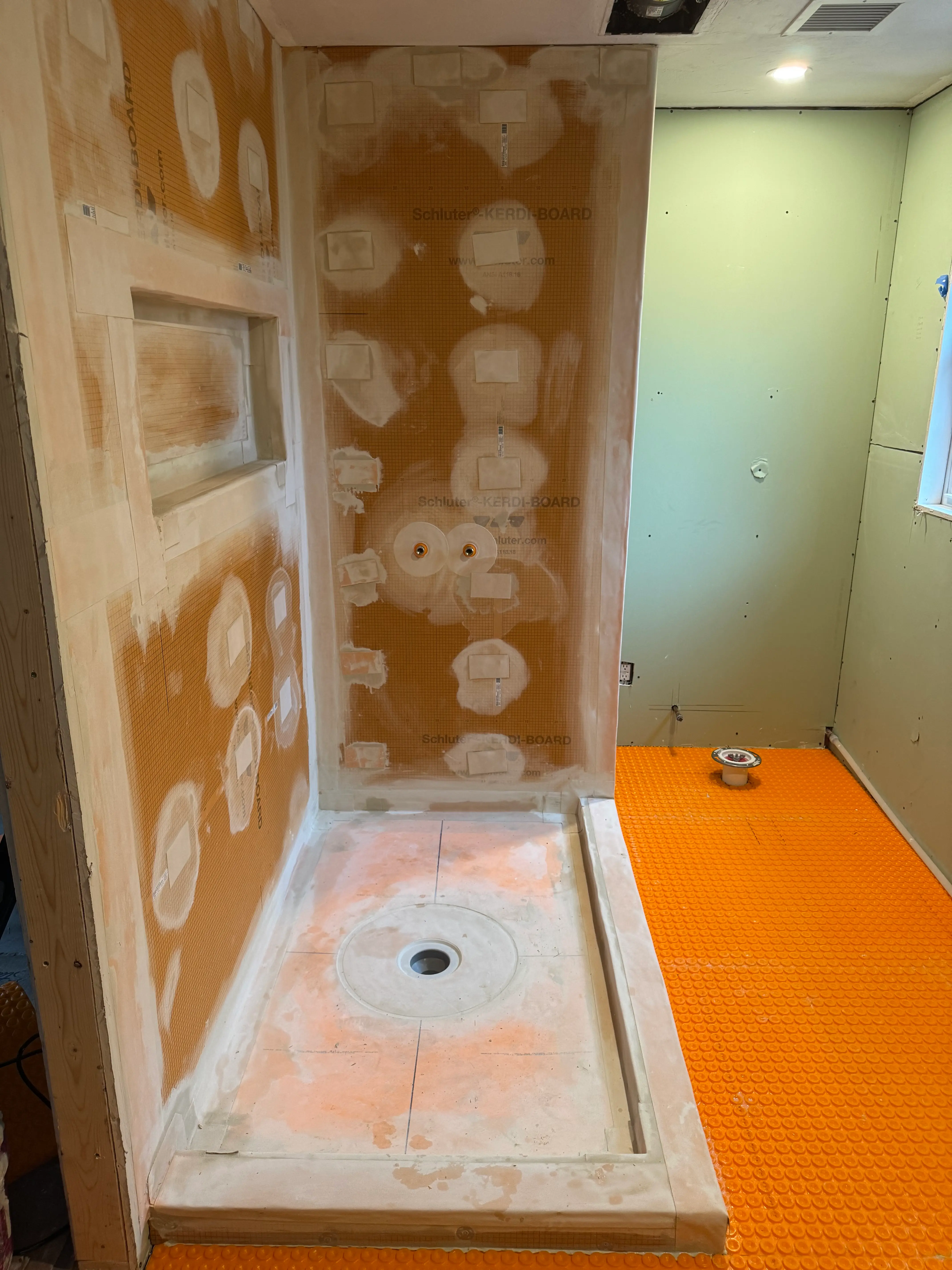 Shower tile and niche installation nearing completion